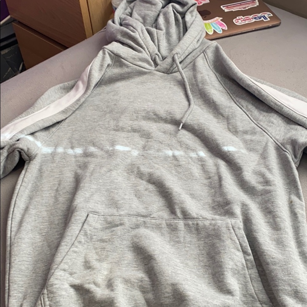 gray sweatshirt, white stripes on sleeves